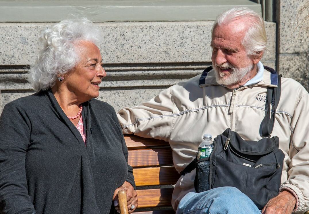 elderly neighbors chatting outside